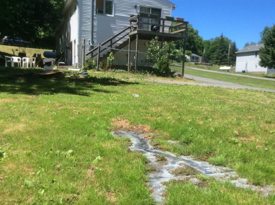 Filthy water surfacing near home foundation